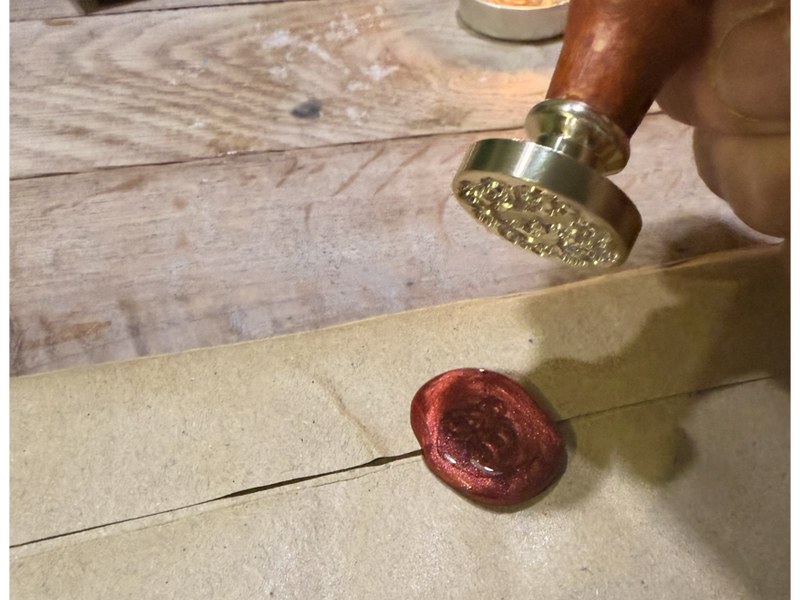 Pouring the wax onto the envelope